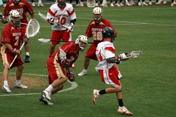 This photo of a collegiate Lacrosse game between the University of Denver Pioneers and the University of Maryland Terrapins was taken by photographer Daniel Steger and is used courtesy of the Creative Commons Attribution ShareAlike 2.5 License.  (http://commons.wikimedia.org/wiki/File:D1_Lacrosse.jpg) 